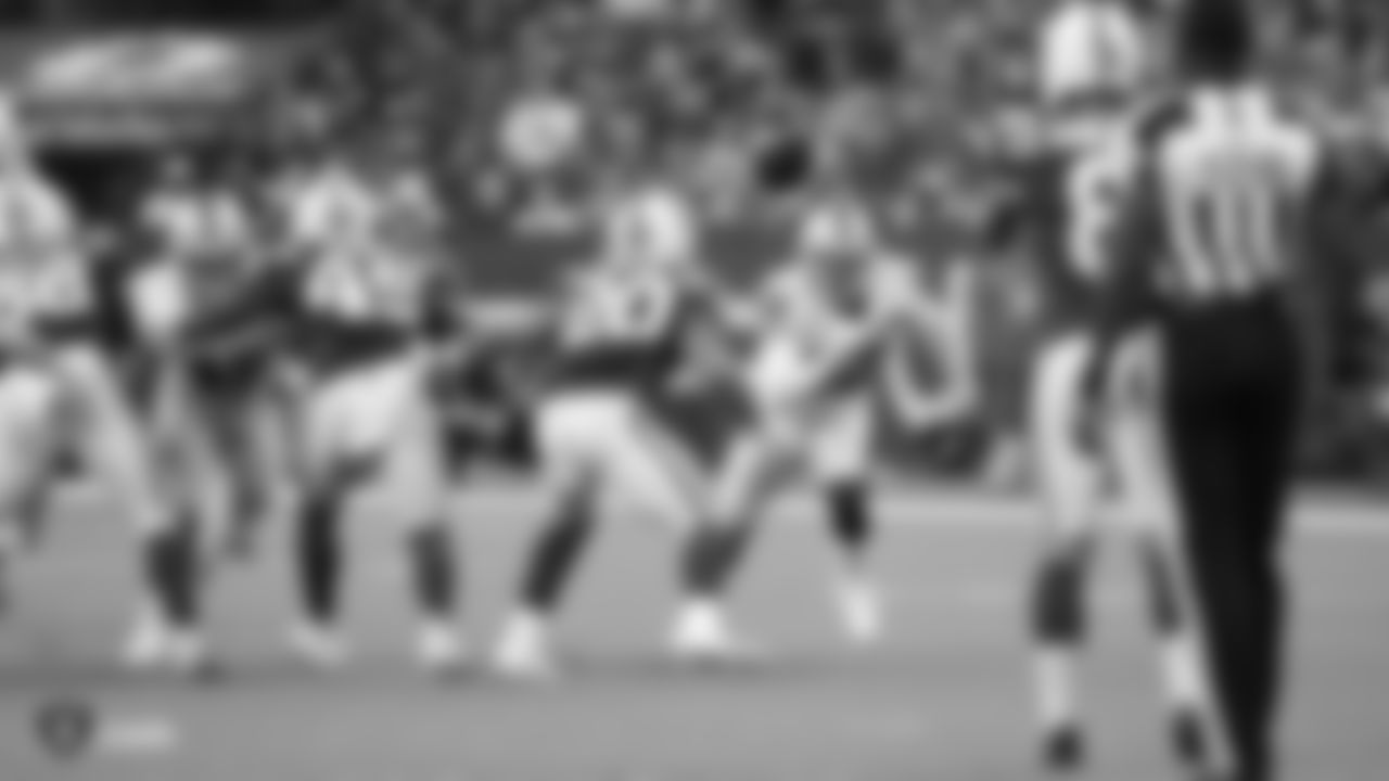 Raiders safety Karl Joseph (42), and safety Dallin Leavitt (32) rush the punter during the Raiders regular season game against the Indianapolis Colts.