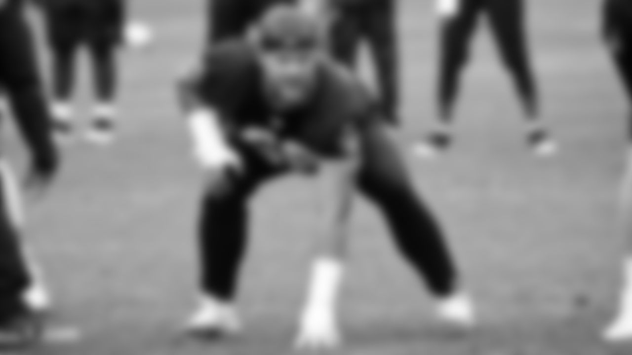 Raiders offensive lineman Andre James (68) gets in his offensive stance on the field during practice.