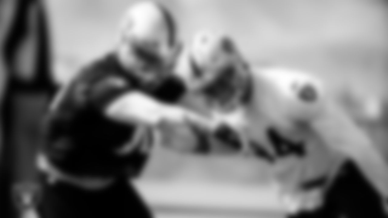 Las Vegas Raiders tackle Sam Young (70) and linebacker Nick Kwiatkoski (44) during practice.