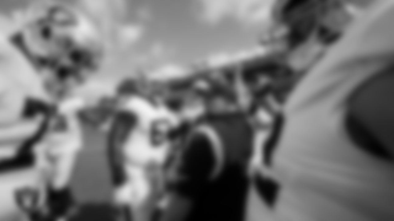 Las Vegas Raiders offensive line coach Carmen Bricillo huddles with the offensive line during warm ups before the regular season away game against the Tennessee Titans at Nissan Stadium.