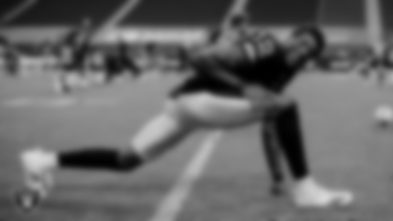 The Raiders warm up before the regular season game against the Denver Broncos at Allegiant Stadium.