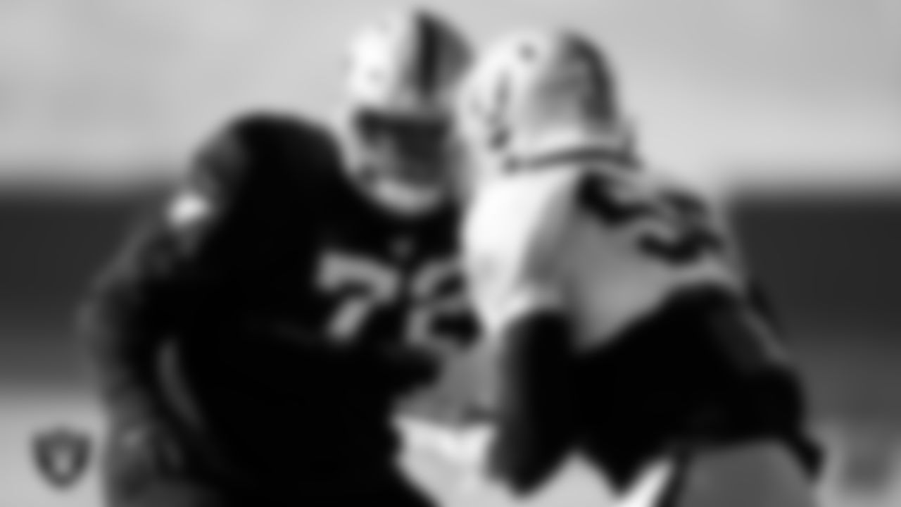 Las Vegas Raiders offensive lineman Jermaine Eluemunor (72) and defensive end Gerri Green (56) during practice at Intermountain Healthcare Performance Center.