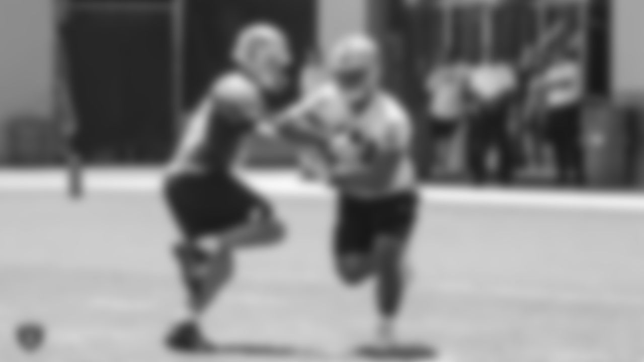 Oakland Raiders quarterback Connor Cook (18) and running back Chris Warren (34) at a Mandatory Mini Camp at the Oakland Raiders Practice Facility, Tuesday, June 12, 2018, in Alameda, California.