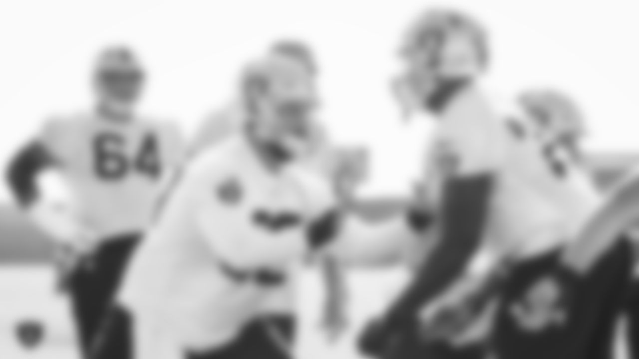 Raiders center Erik Magnuson (62) goes through offensive drills during practice.