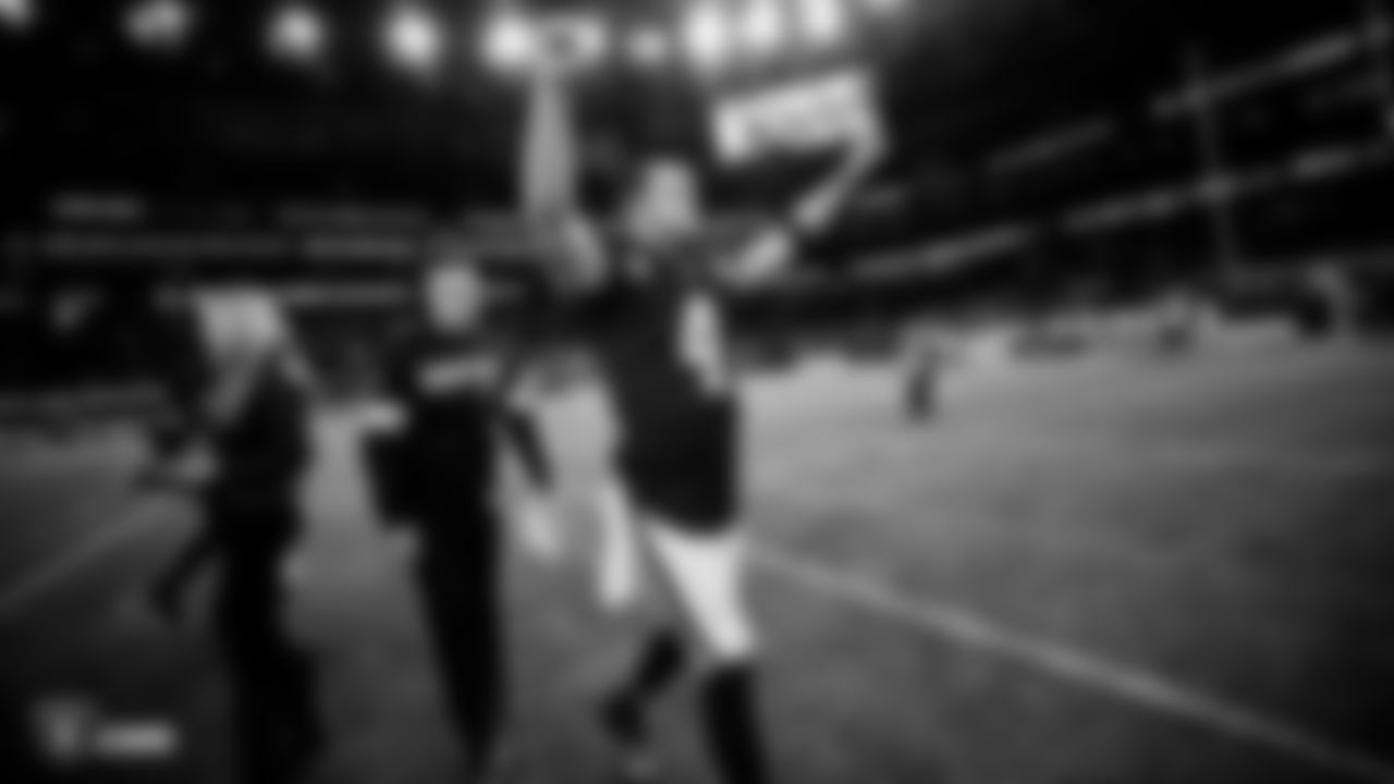 Raiders quarterback Derek Carr (4) celebrates after the regular season game against the Chicago Bears at Tottenham Hotspur Stadium.