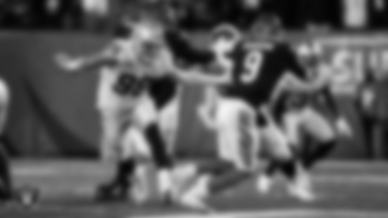 Las Vegas Raiders defensive end Maxx Crosby (98) rushes the quarterback during the postseason away game against the Cincinnati Bengals.
