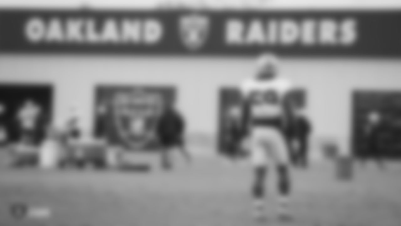 Raiders linebacker Tahir Whitehead (59) stands on the field.