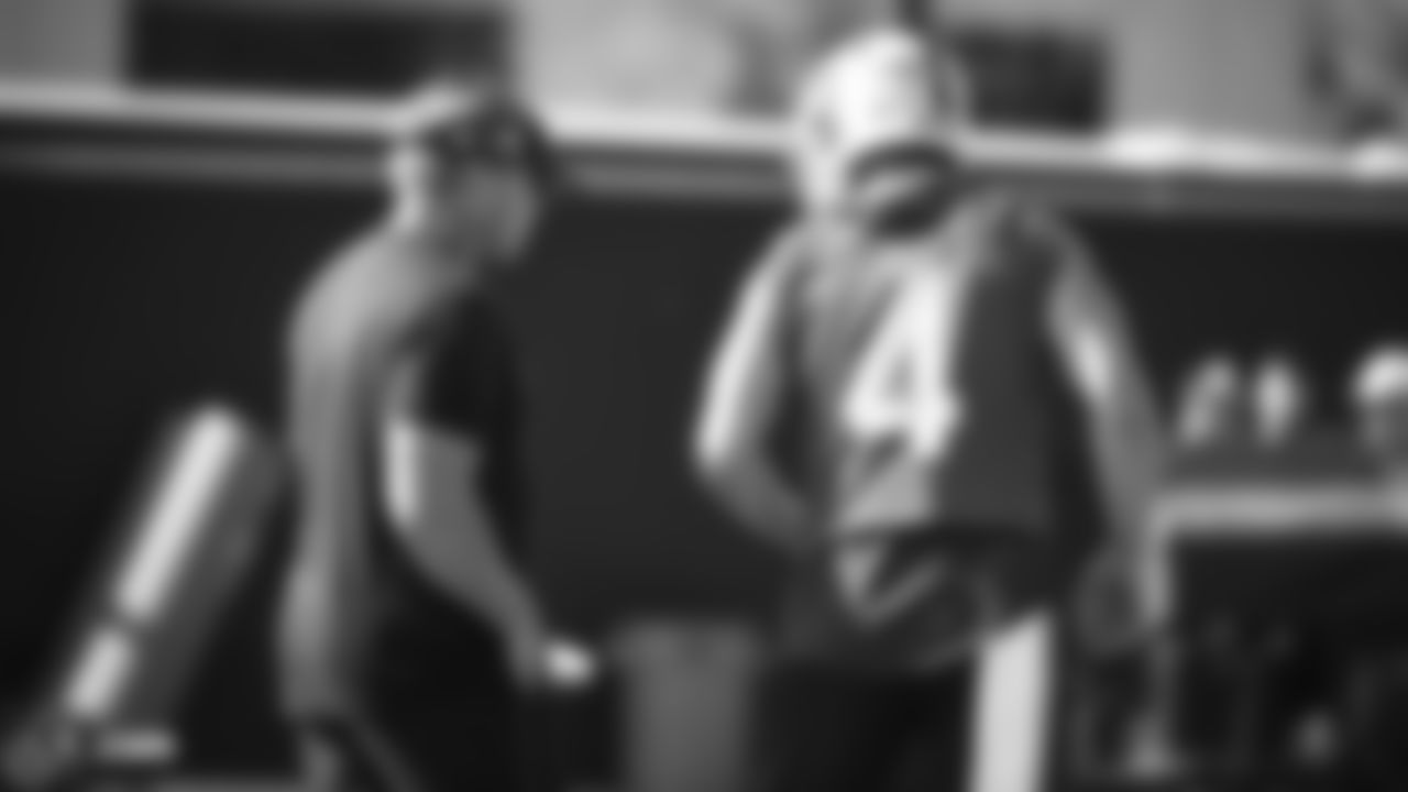 Raiders Head Coach Jon Gruden talks with quarterback Derek Carr (4) during practice.