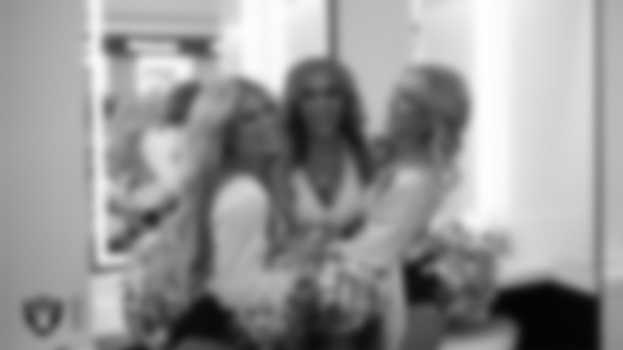 Raiderettes Jennifer, Bree and Madison E. in the locker room before the regular season home game against the Chicago Bears.