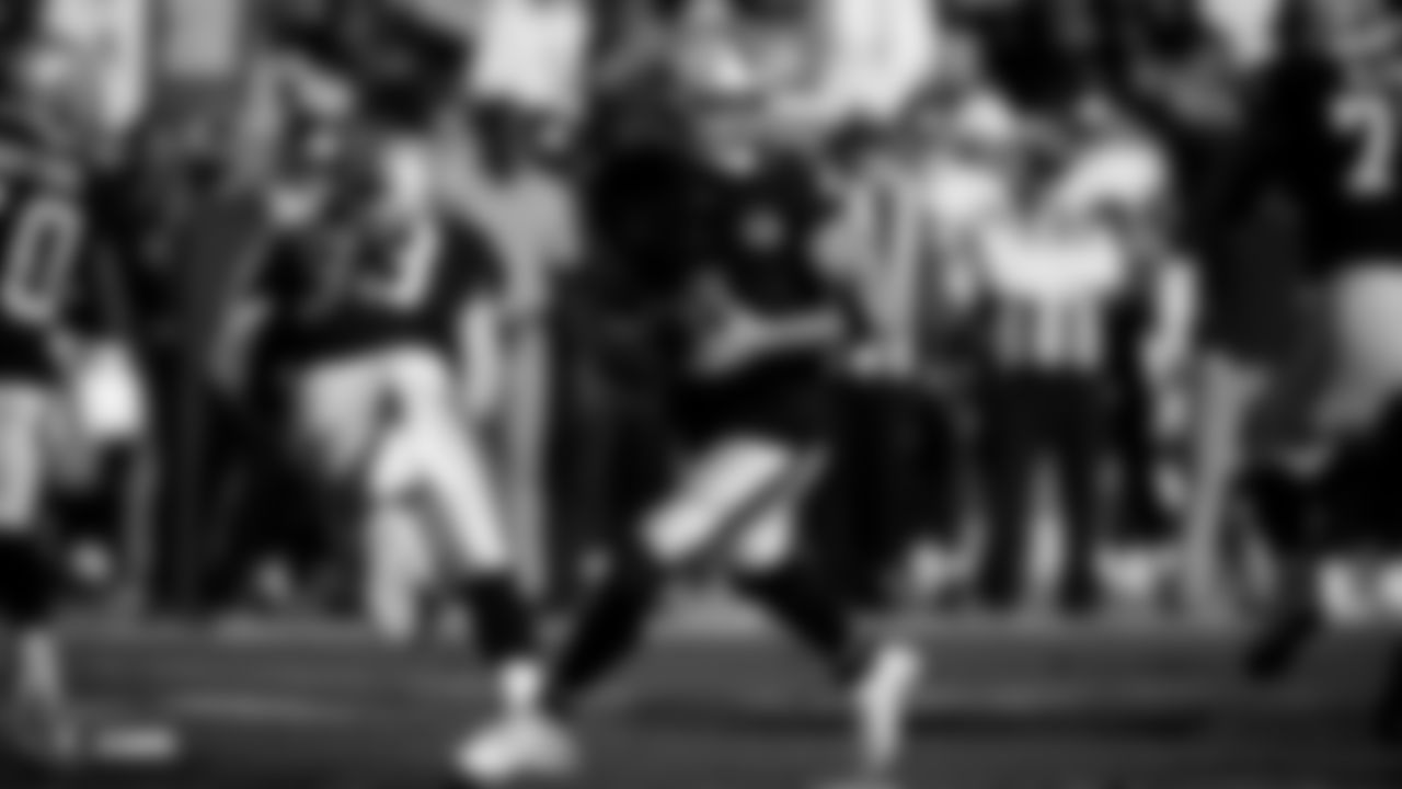 Raiders quarterback Derek Carr (4) drops backs to pass during the regular season game against the Tennessee Titans.