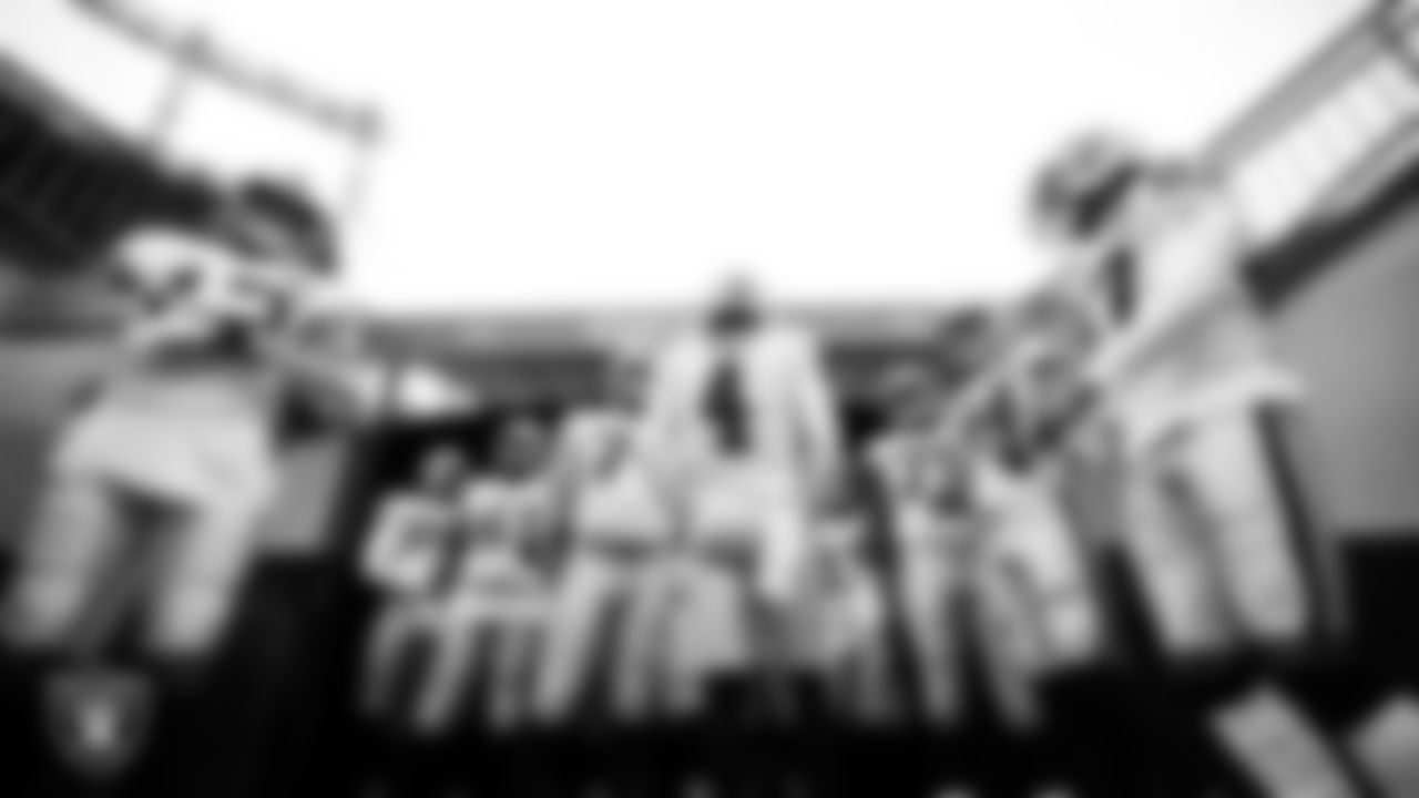 The Las Vegas Raiders wait to be introduced onto the field before the regular season away game against the Denver Broncos.