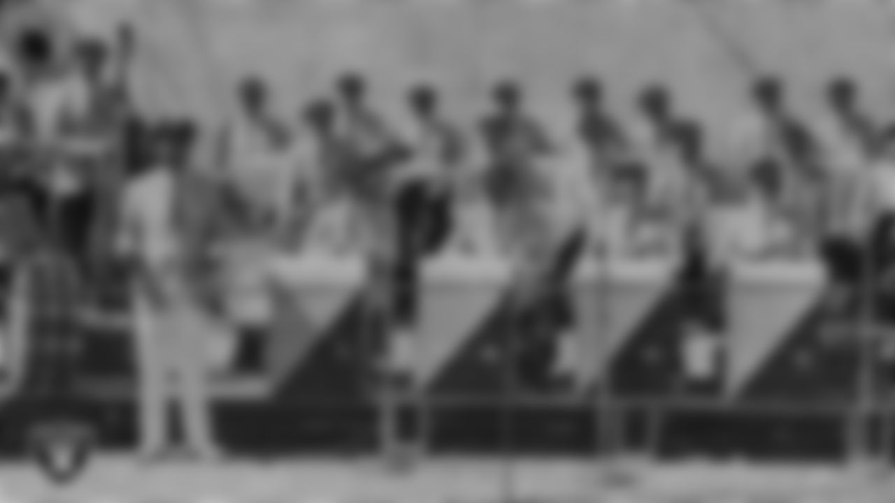 The Raiders Band, directed by Del Courtney, pose for a photo during a Raiders home game.