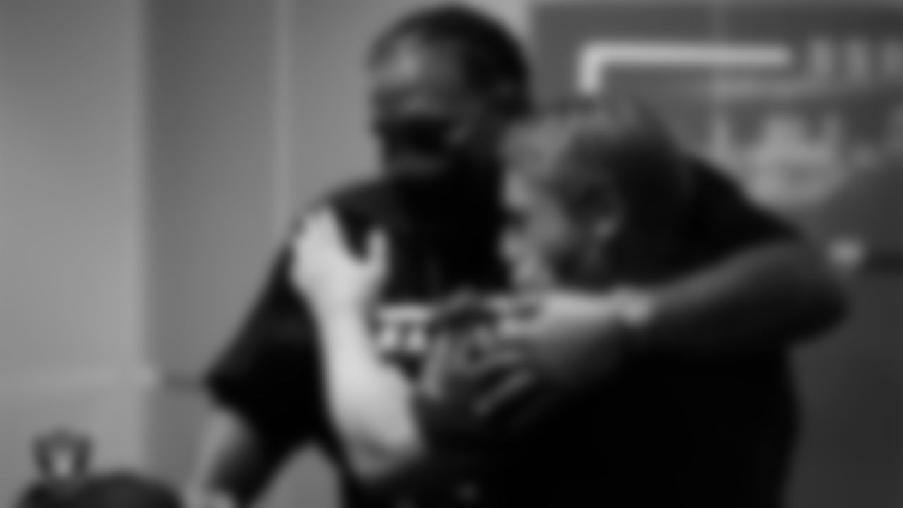 Las Vegas Raiders Head Coach Jon Gruden hugs tackle Donald Penn before Penn signs a one-day contract to retire as a member of the Las Vegas Raiders.