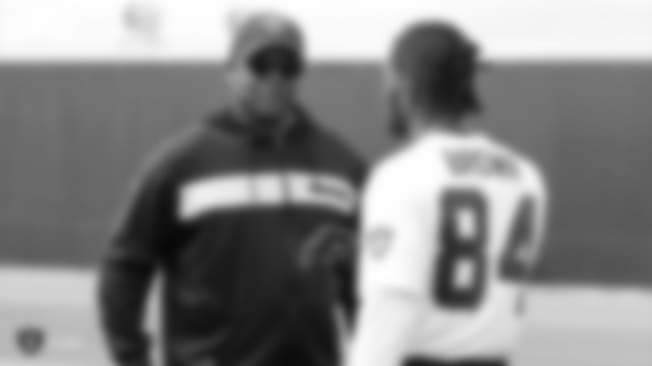 Raiders wide receivers coach Edgar Bennett and wide receiver Antonio Brown (84) at a workout during phase two of the offseason program at the Raiders Practice Facility in Alameda, Calif.