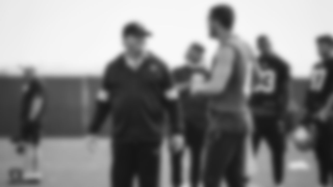 Raiders Head Coach Jon Gruden talks with quarterback Derek Carr (4) during practice.