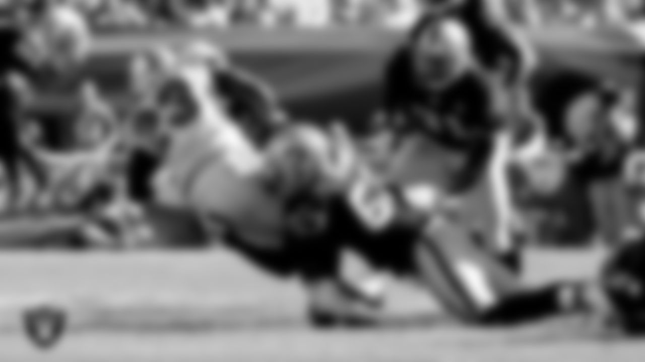 Raiders linebacker Thomas Howard (53) makes a tackle during the regular season away game against the Miami Dolphins at Dolphin Stadium, Sunday, November 16, 2008, in Miami Gardens, Fla.