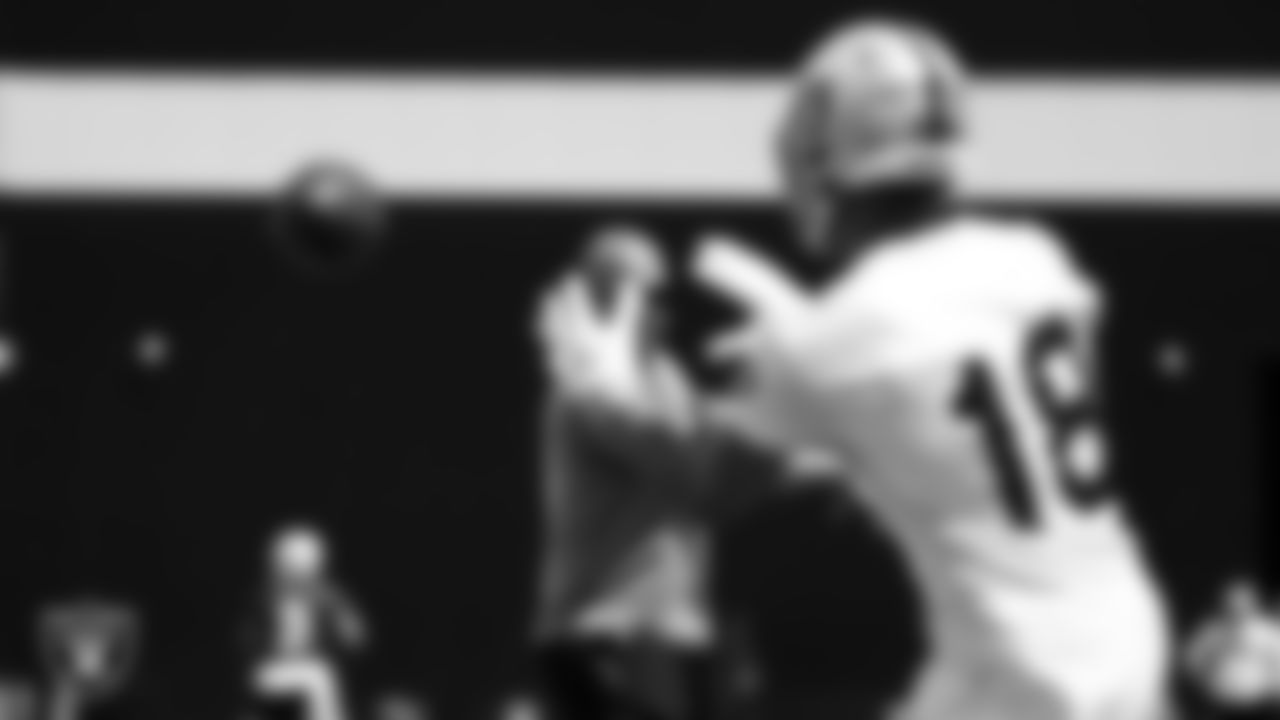 Las Vegas Raiders offensive quality control coach Nick Holz and wide receiver Keelan Doss (18) at an Organized Team Activity (OTA).