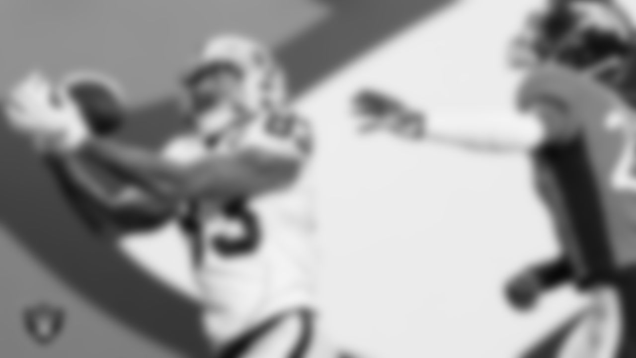 Las Vegas Raiders tight end Darren Waller (83) makes a 28-yard touchdown catch during the regular season game against the Denver Broncos at Empower Field at Mile High.