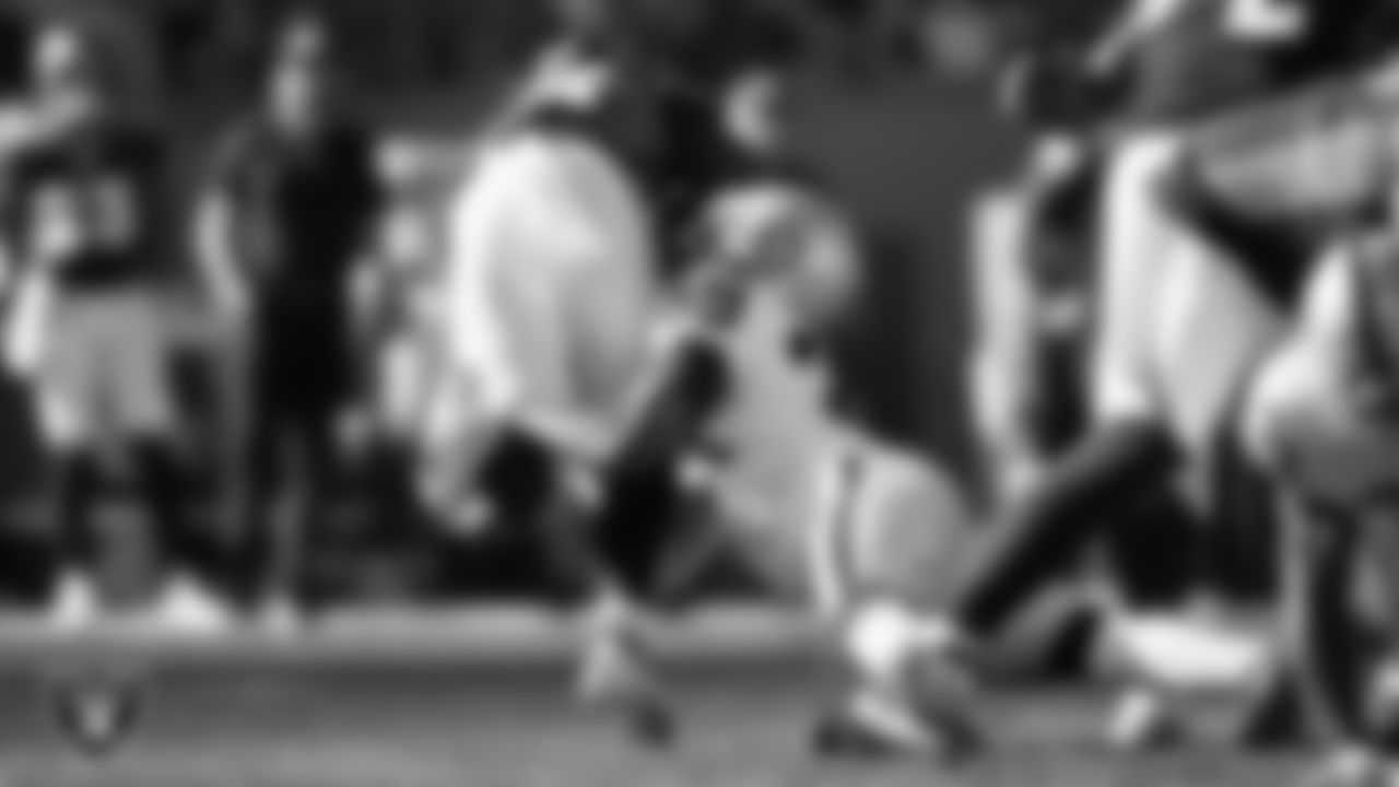 Las Vegas Raiders cornerback Nate Hobbs (39) makes a tackle during the regular season away game against the Denver Broncos.