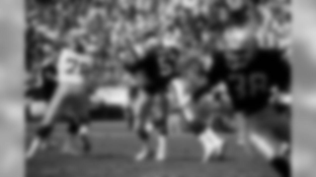 Jerry Robinson lays a hit on the Rams quarterback in a 1988 match-up with the Rams.