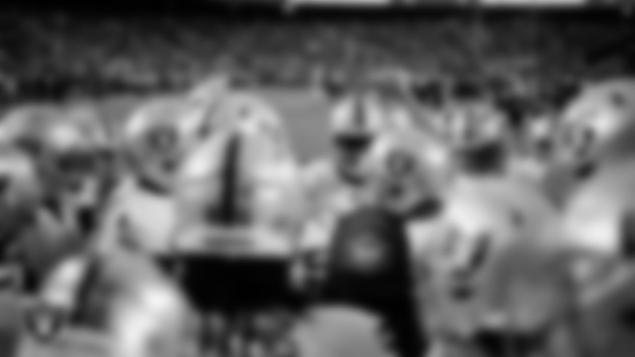 Las Vegas Raiders quarterback Derek Carr (4) fires up the team in a huddle during warm ups before the regular season away game against the Kansas City Chiefs at GEHA Field at Arrowhead Stadium.