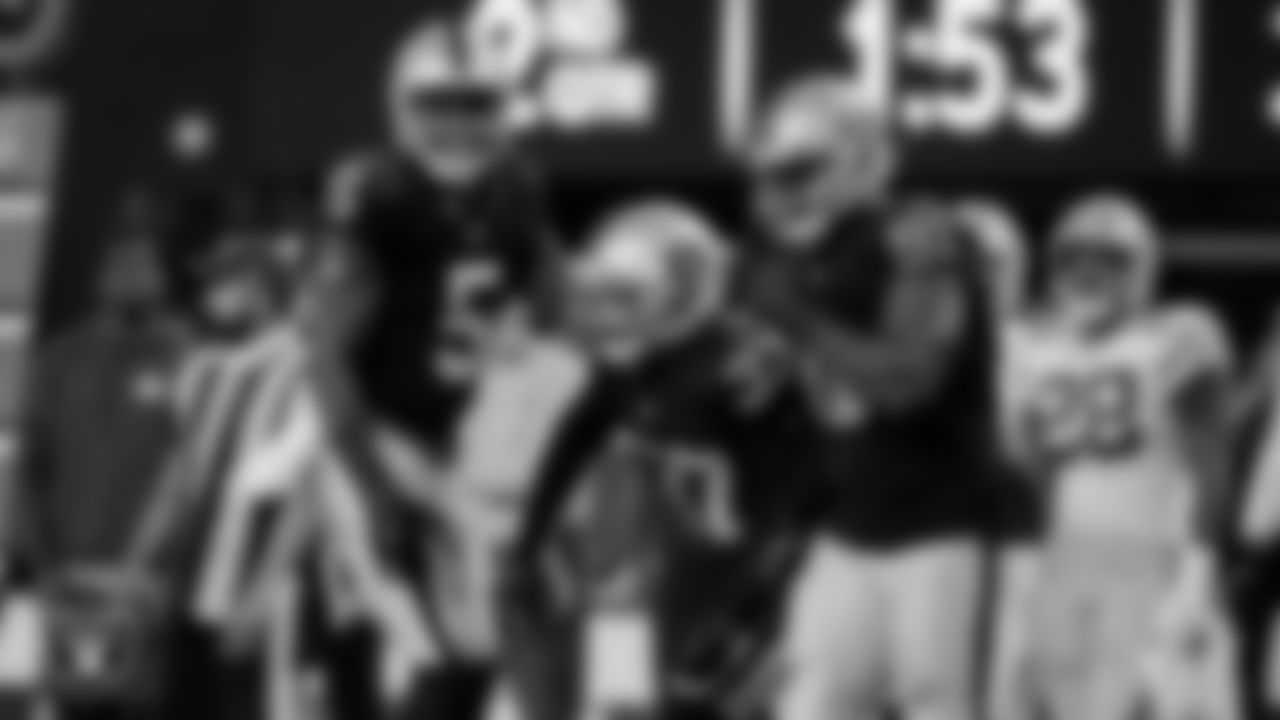 Las Vegas Raiders linebacker Divine Deablo (5), cornerback Tyler Hall (37) and defensive tackle Bilal Nichols (91) during the regular season home game against the Green Bay Packers at Allegiant Stadium.