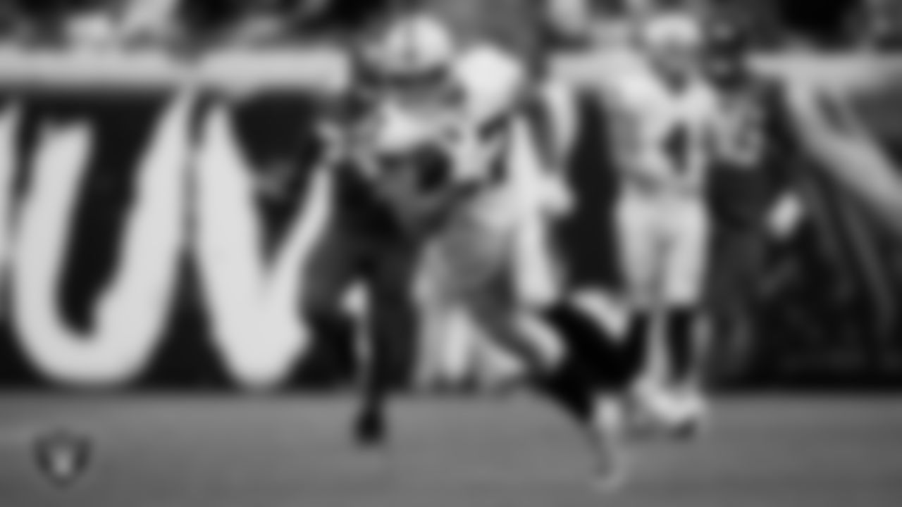 Las Vegas Raiders tight end Foster Moreau (87) runs after making a catch during the regular season away game against the Jacksonville Jaguars at TIAA Bank Field.
