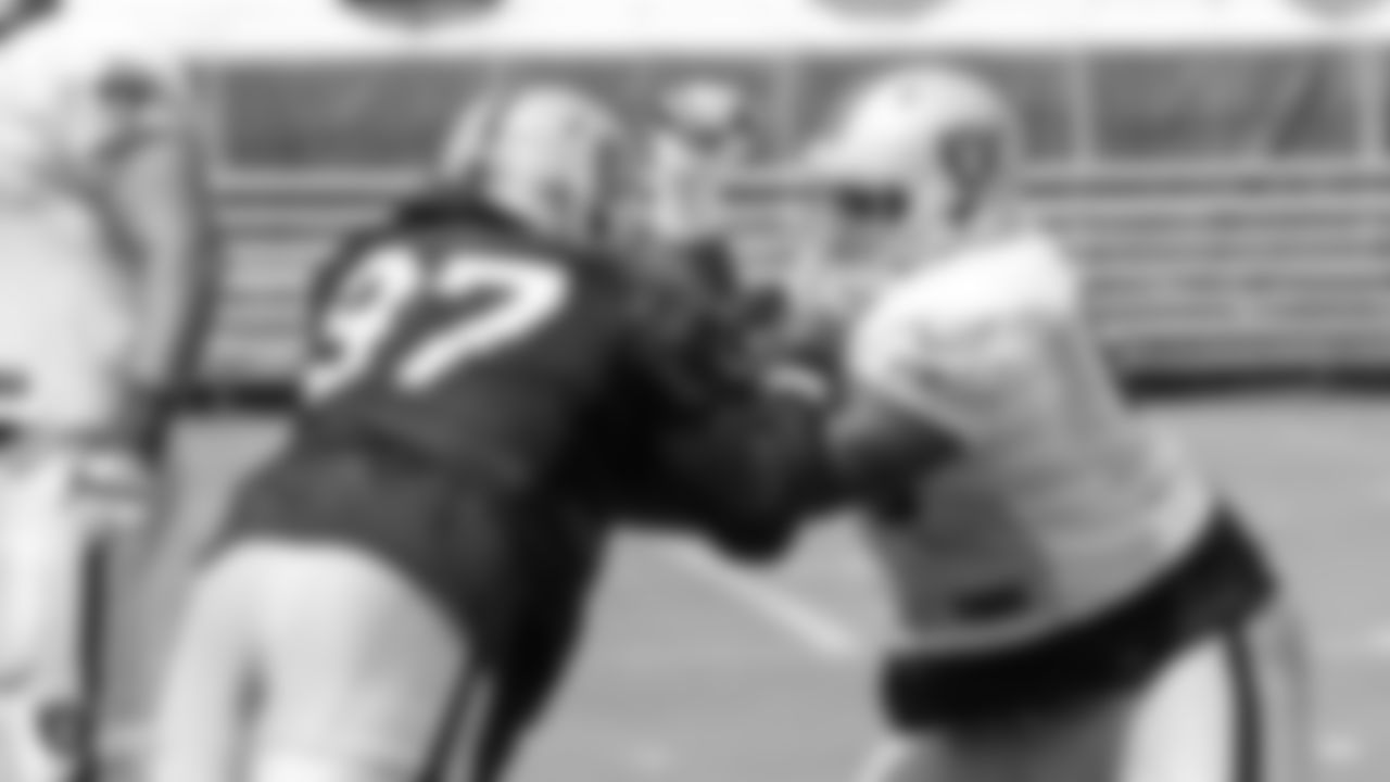 Oakland Raiders defensive end Mario Edwards Jr. (97) and offensive guard Gabe Jackson (66) on the field for practice at 2018 Training Camp at The Oakland Raiders Napa Valley Training Complex, Thursday, August 2, 2018, in Napa, California.