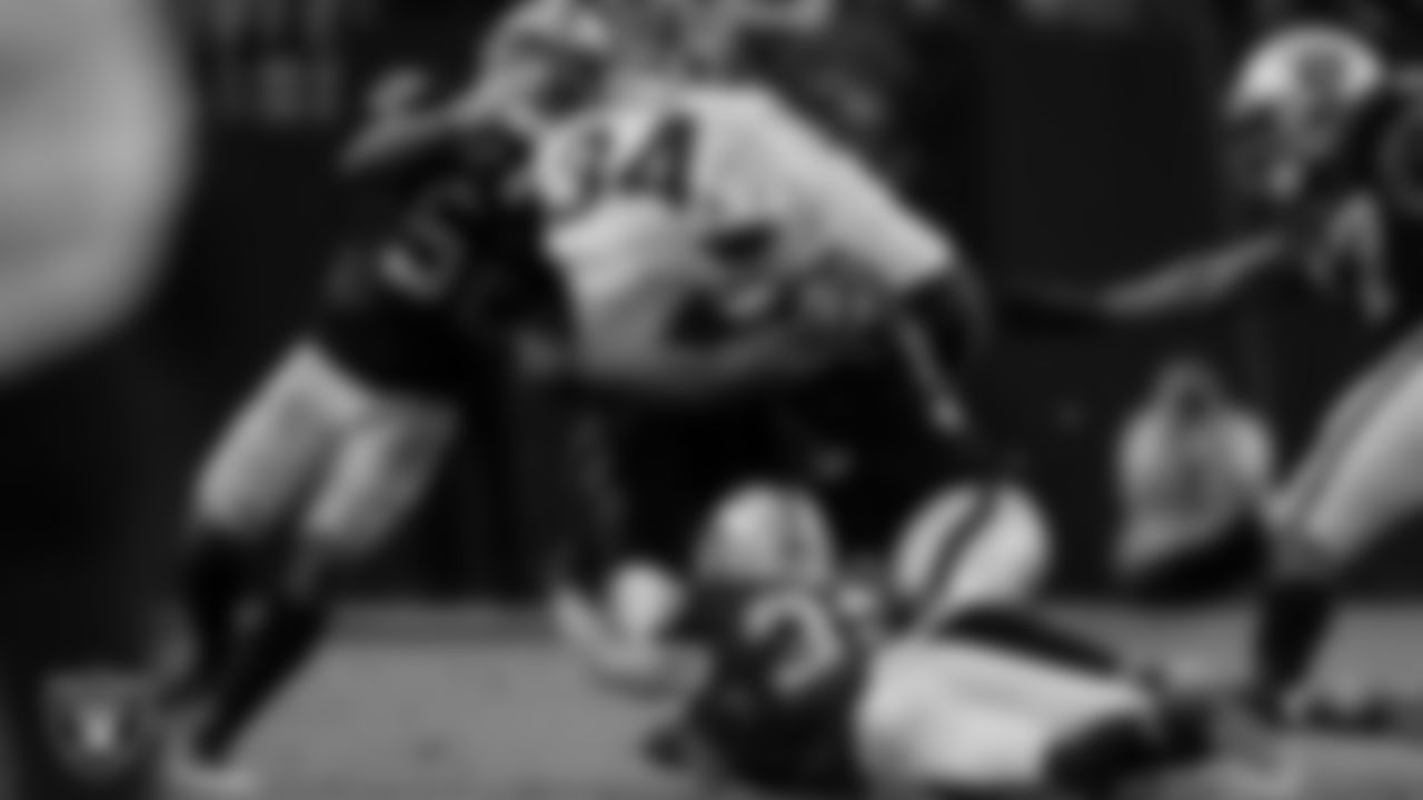 Las Vegas Raiders linebacker Denzel Perryman (52), defensive end Yannick Ngakoue (91) and safety Dallin Leavitt (32) during the regular season home game against the Cincinnati Bengals.