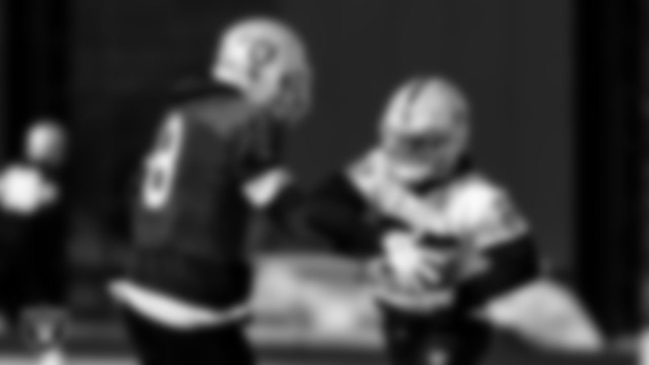 Las Vegas Raiders quarterback Marcus Mariota (8) and running back Theo Riddick (35) during practice at Intermountain Healthcare Performance Center.