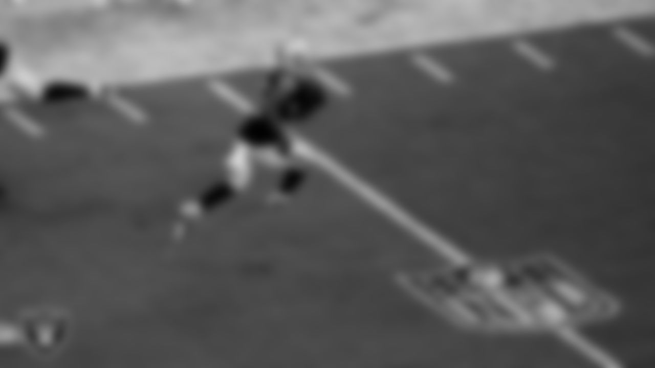 Las Vegas Raiders running back Zamir White (35) rushes during the regular season home game against the Denver Broncos at Allegiant Stadium.
