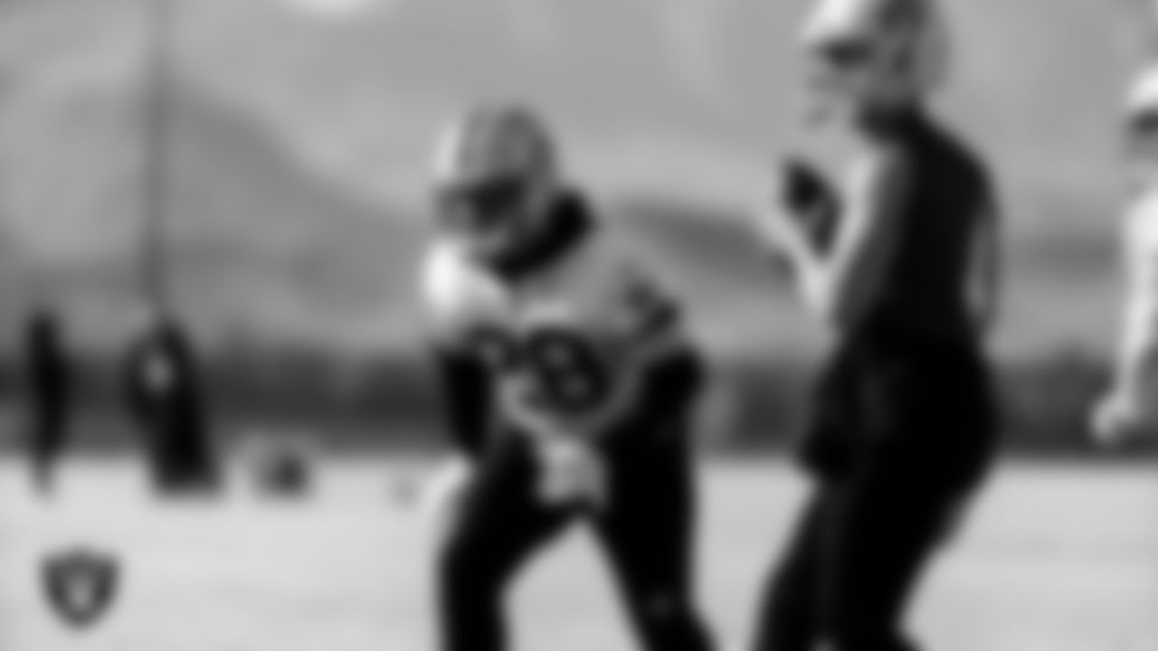 Las Vegas Raiders running back Josh Jacobs (28) and quarterback Derek Carr (4) during practice at Intermountain Healthcare Performance Center.