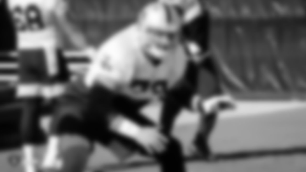 Raiders offensive lineman Kyle Kalis (70) goes through offensive drills during practice.