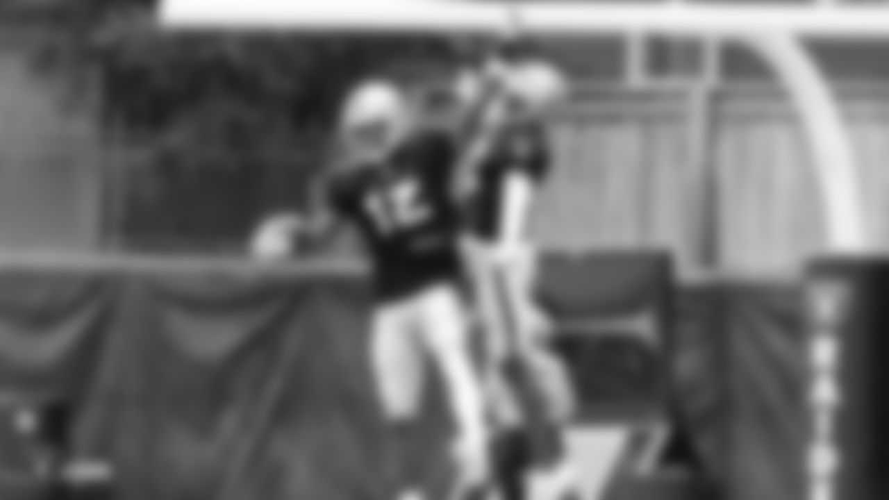 Oakland Raiders wide receiver Martavis Bryant (12) with wide receiver Johnny Holton (16) celebrating on the field for practice at 2018 Training Camp at The Oakland Raiders Napa Valley Training Complex, Wednesday, August 8, 2018, in Napa, California.