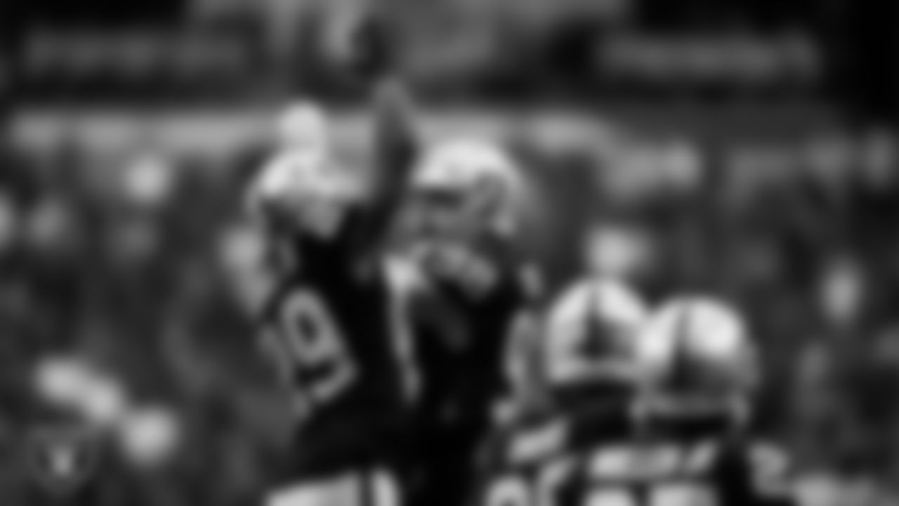 Las Vegas Raiders cornerback Casey Hayward Jr. (29) celebrates with defensive end Maxx Crosby (98) after recording a safety during the regular season home game against the Miami Dolphins.