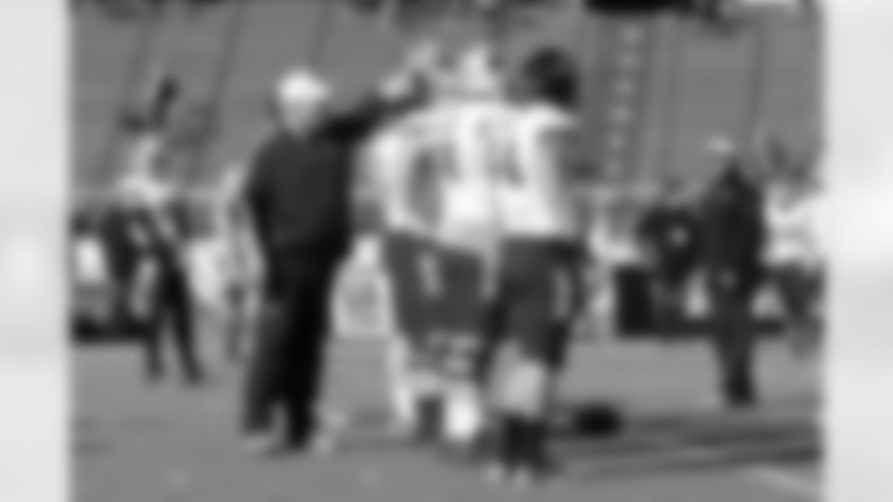 Tight ends coach Mark Hutson coaches up the offensive line.