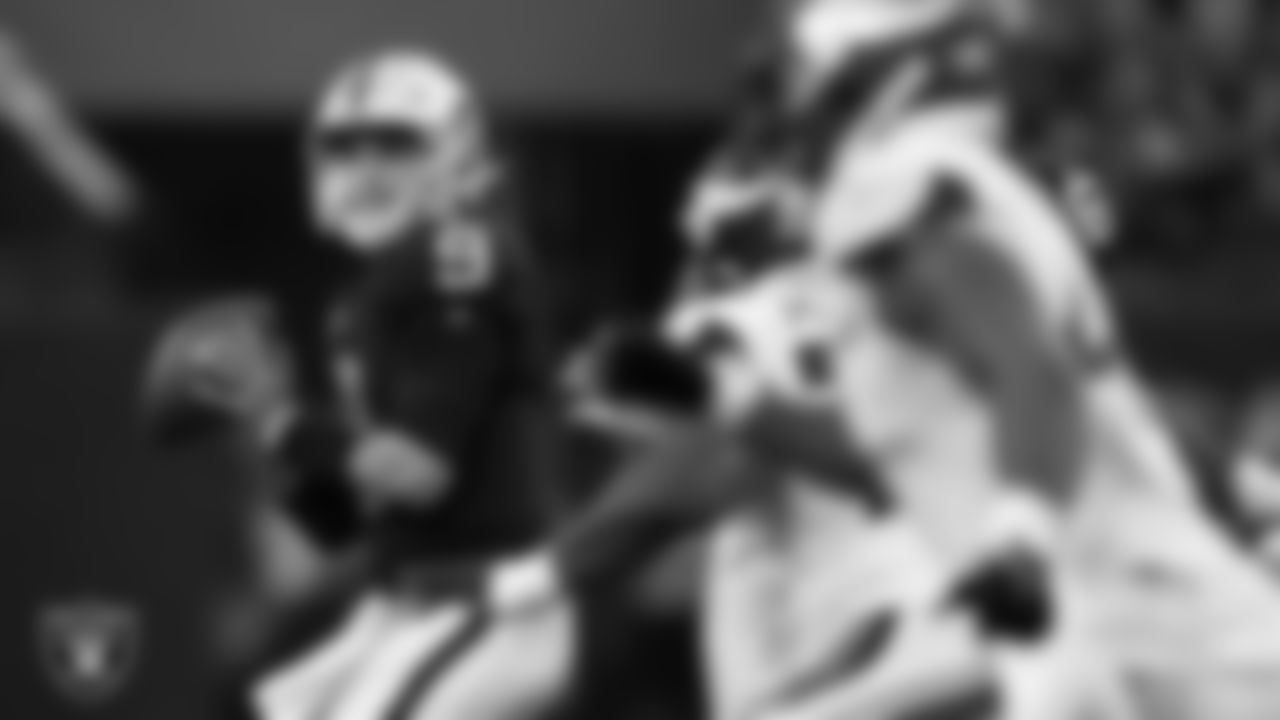 Las Vegas Raiders quarterback Nick Mullens (9) looks for a receiver during the preseason home game against the Minnesota Vikings at Allegiant Stadium.