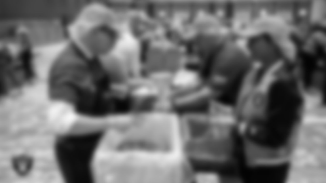 Las Vegas Raiders President Sandra Douglass Morgan and volunteers pack meals during the Feed the Funnel Party at Wynn Resort.