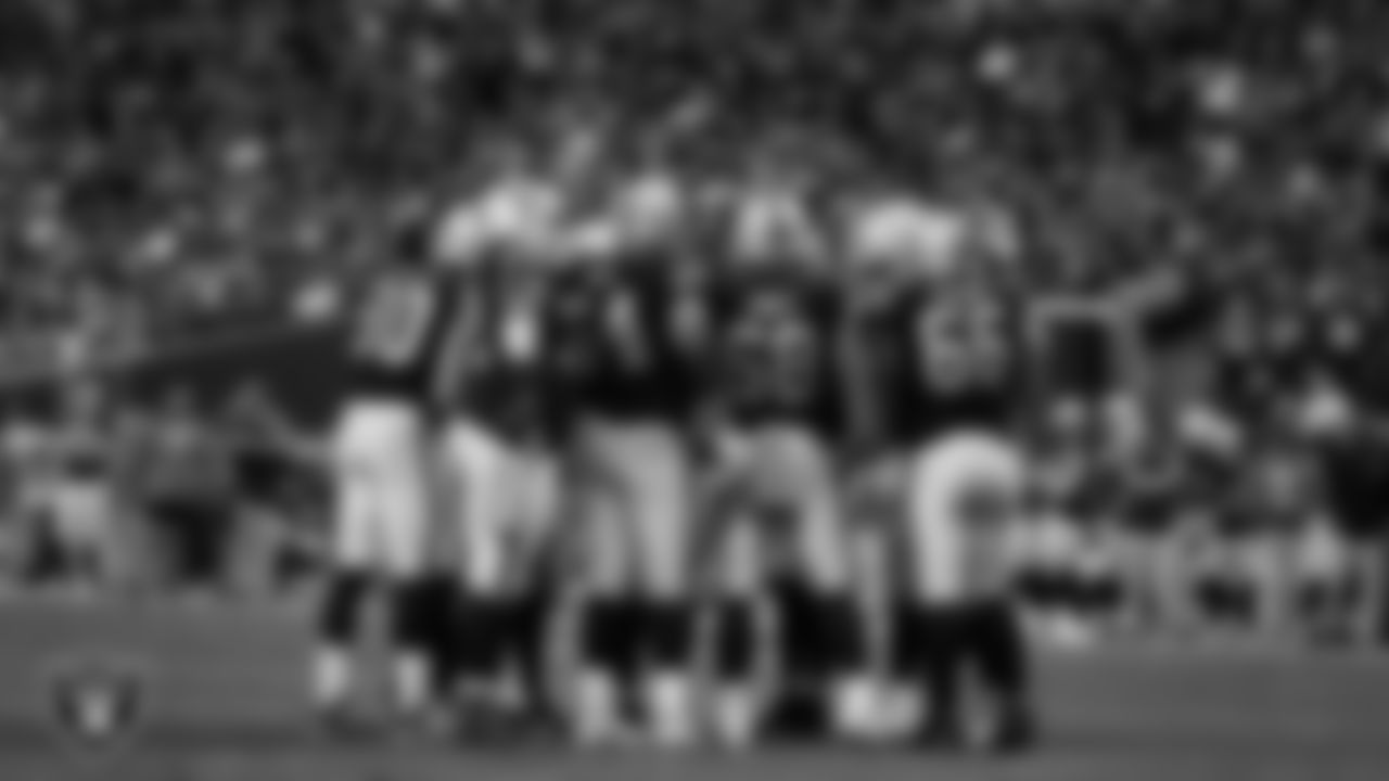 The Las Vegas Raiders offense huddles during the regular season home game against the Indianapolis Colts at Allegiant Stadium.
