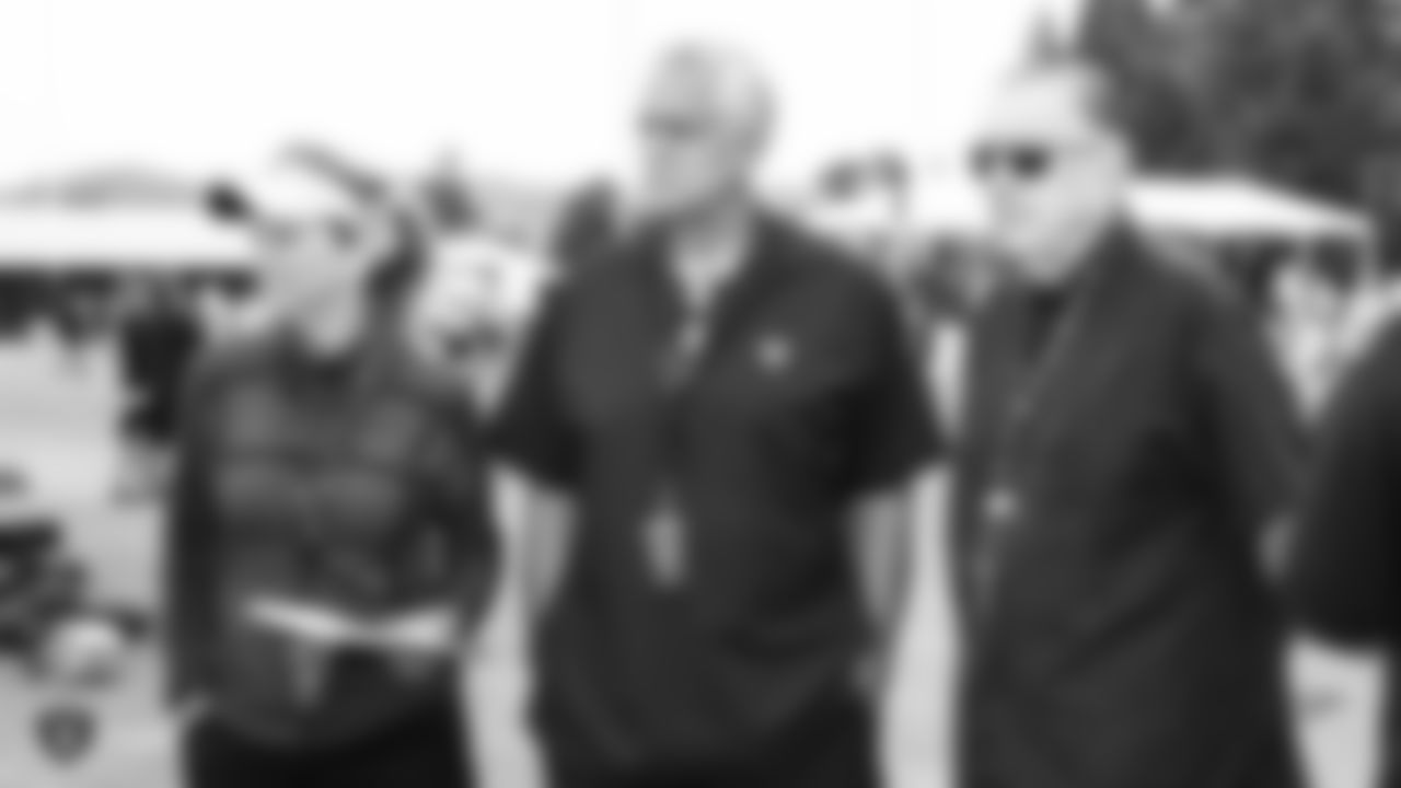 ESPN and CBS play-by-play announcer Beth Mowins, Oakland Raiders alumnus Matt Millen, and Raiders play-by-play announcer Brent Musburger on the field for practice at 2018 Training Camp at The Oakland Raiders Napa Valley Training Complex, Wednesday, August 8, 2018, in Napa, California.