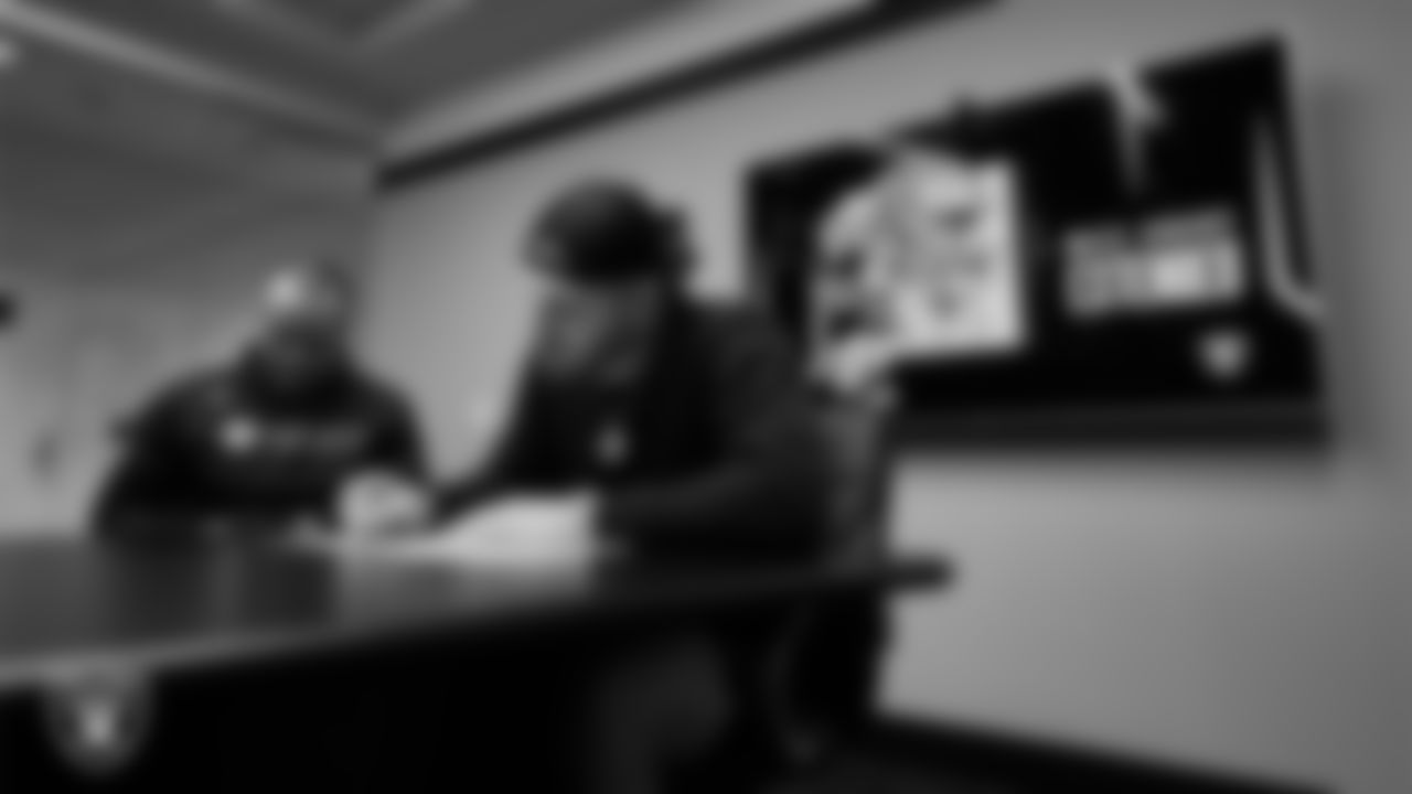 Las Vegas Raiders defensive end Maxx Crosby signs a contract extension.