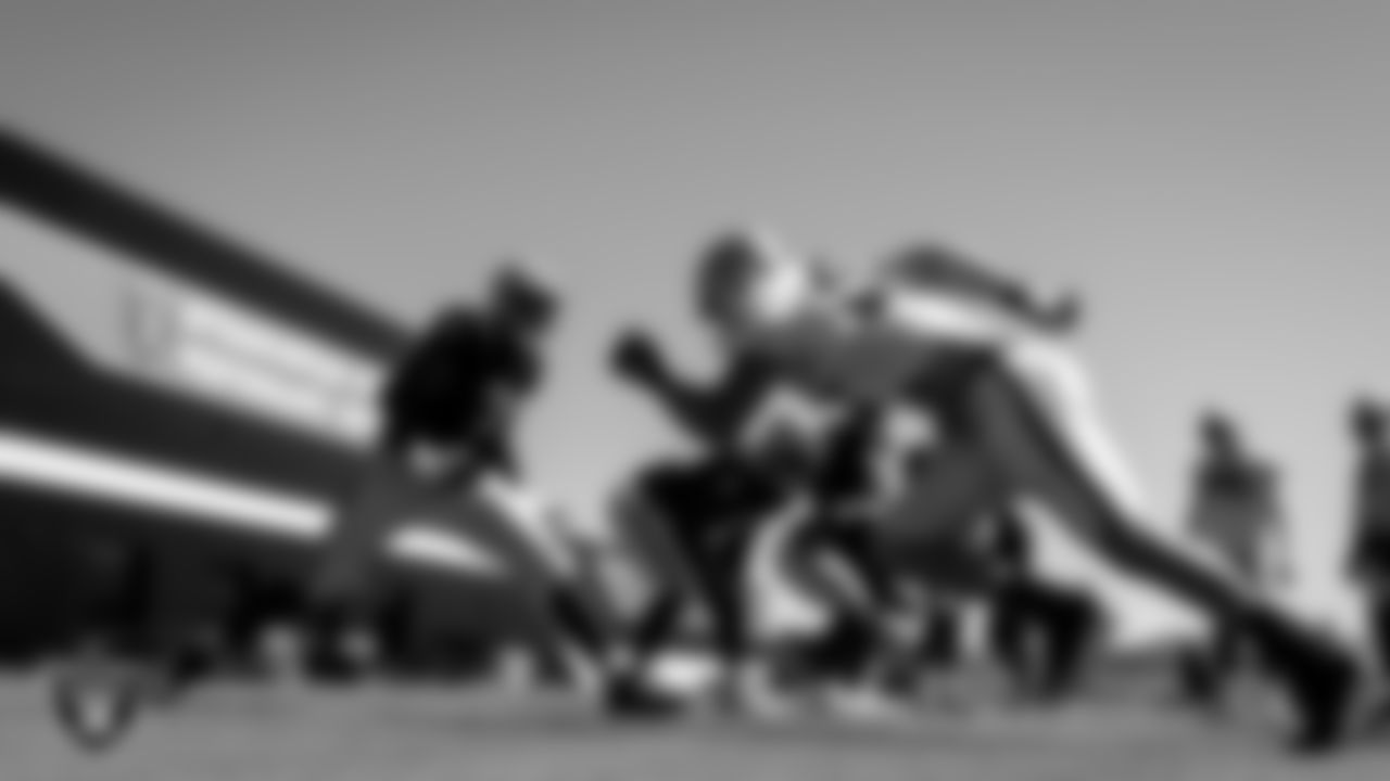 Las Vegas Raiders tackle Brandon Parker (75) and defensive end Carl Nassib (94) during practice.