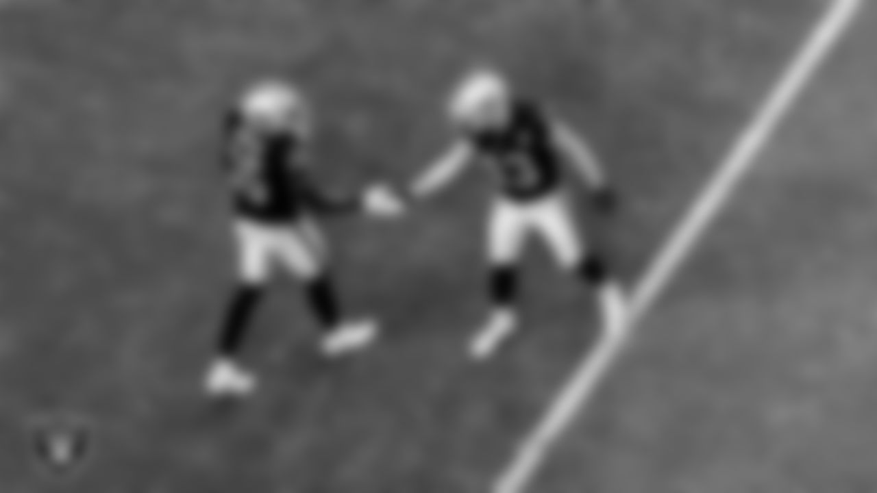 Las Vegas Raiders wide receiver Nelson Agholor (15) is congratulated by wide receiver Hunter Renfrow (13) after making a catch during the regular season home game against the Tampa Bay Buccaneers.