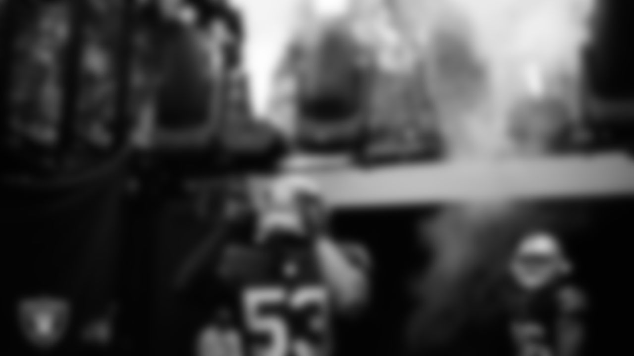 Las Vegas Raiders linebacker Tae Davis (53) walks down the tunnel before the preseason home game against the New England Patriots at Allegiant Stadium.