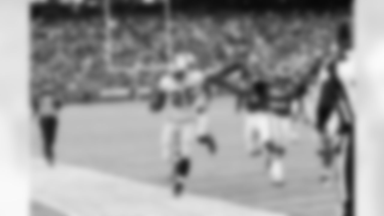 RB Mike Goodson is finally forced out of bounds.
