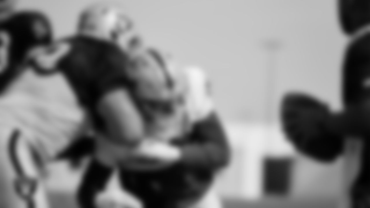 Las Vegas Raiders tackle Jackson Barton (78) and defensive end Maxx Crosby (98) during practice at Intermountain Healthcare Performance Center.