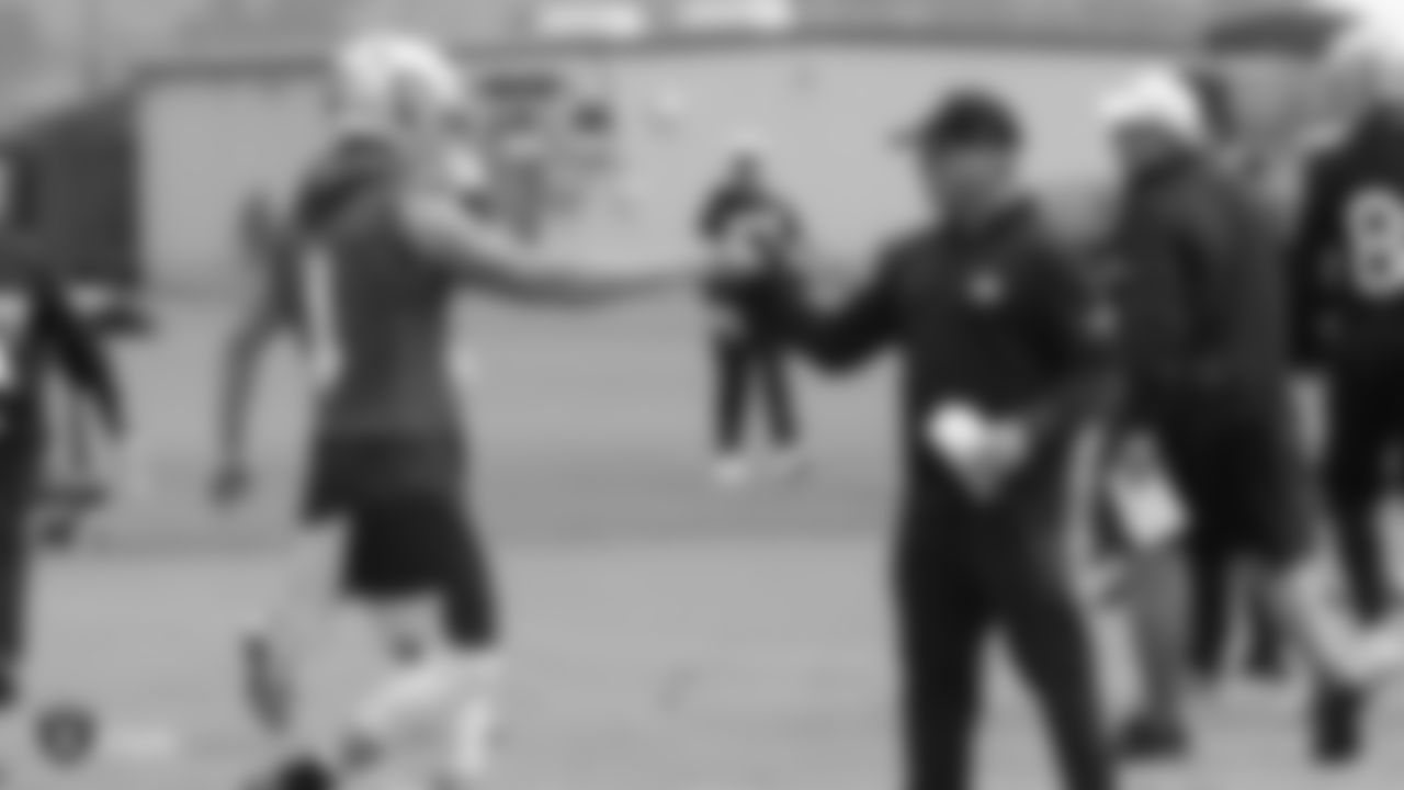 Raiders quarterback Derek Carr (4) and Head Coach Jon Gruden on the field for practice.