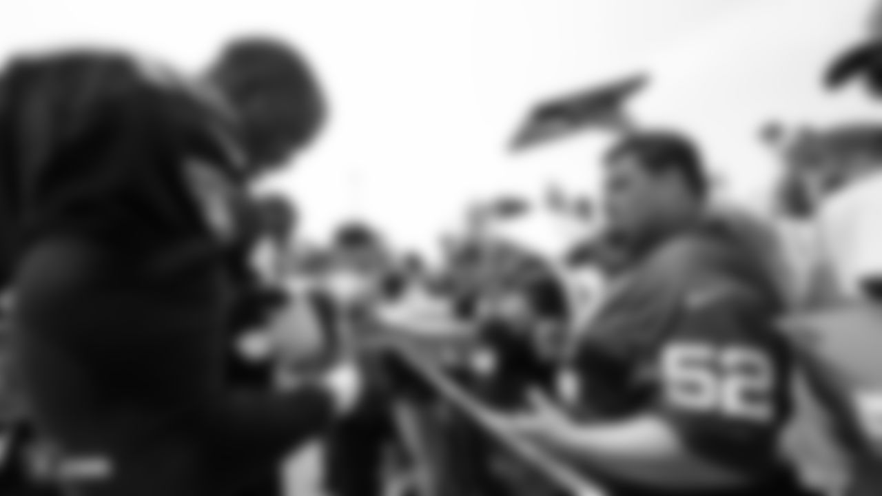Oakland Raiders defensive lineman Tank Carradine (96) signs autographs for fans after practice at 2018 Training Camp at The Oakland Raiders Napa Valley Training Complex, Sunday, July 29, 2018, in Napa, California.