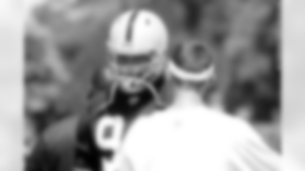 DT Richard Seymour listens to head coach Dennis Allen.