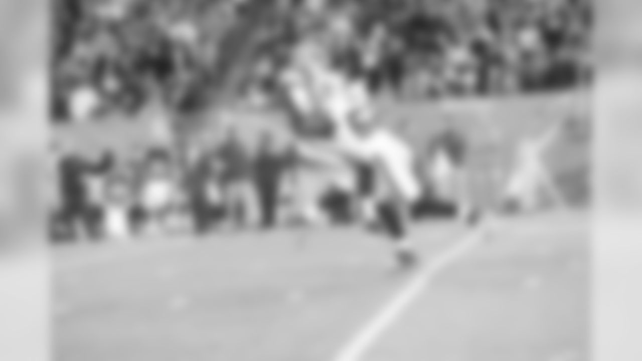 LB Khalil Mack rushes through the middle and lays a hit on the Cleveland quarterback.